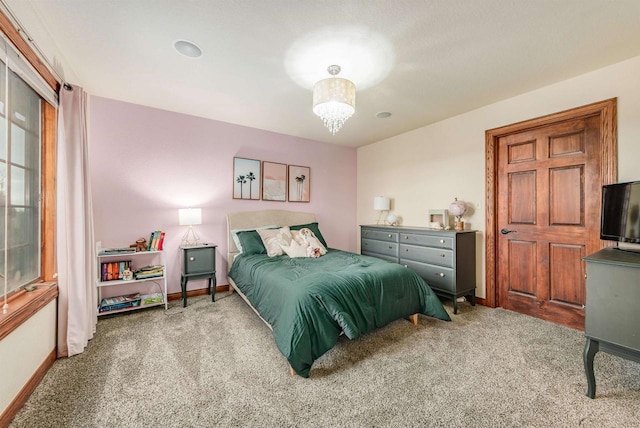 carpeted bedroom with baseboards