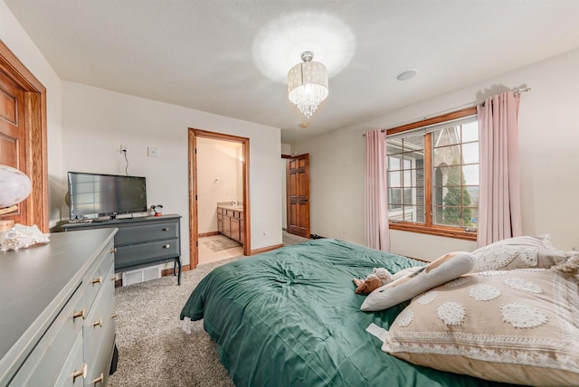 bedroom featuring baseboards, a notable chandelier, and light colored carpet