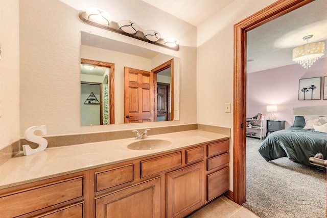 bathroom with vanity and tile patterned flooring