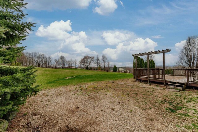 view of yard featuring a deck and a pergola