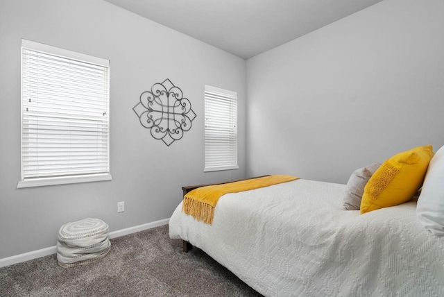 carpeted bedroom with baseboards