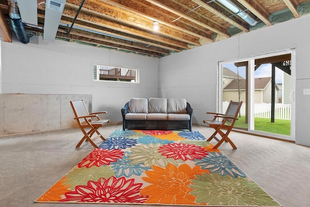 living room featuring concrete flooring