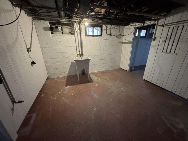 below grade area with a sink