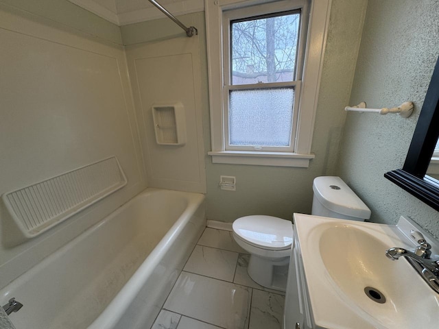 bathroom with marble finish floor, toilet, shower / bath combination, vanity, and baseboards