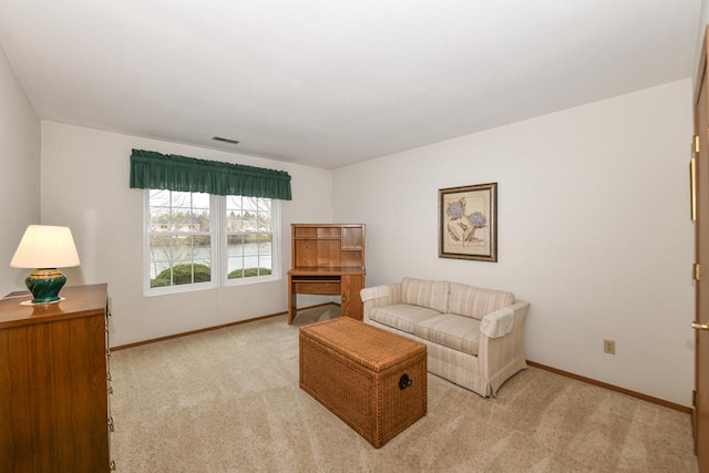 living room featuring baseboards, visible vents, and carpet flooring
