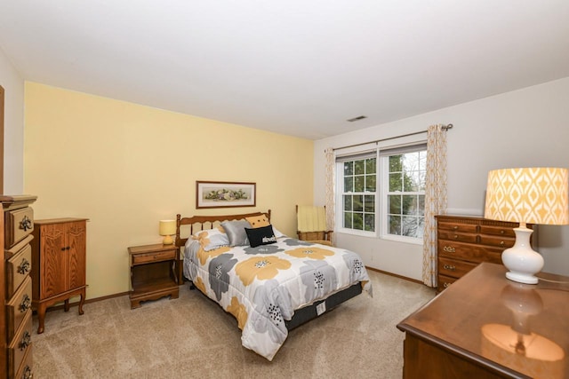 bedroom with visible vents, baseboards, and carpet floors