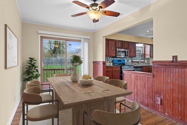9073 N Joyce Ave, Milwaukee, WI 53224 - dining area with baseboards, ceiling fan, and dark wood-style flooring