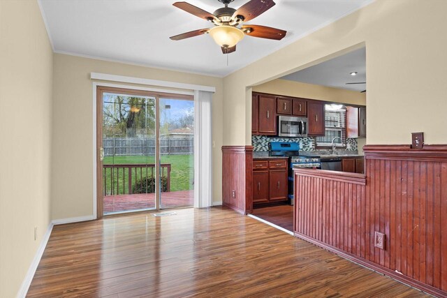 9073 N Joyce Ave, Milwaukee, WI 53224 - kitchen with dark countertops, stainless steel appliances, and dark wood finished floors