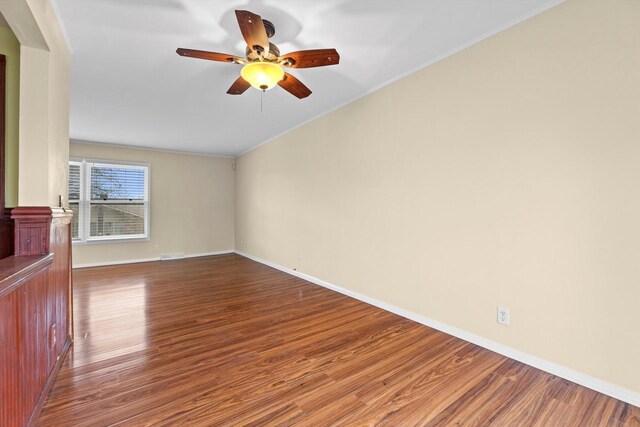 9073 N Joyce Ave, Milwaukee, WI 53224 - empty room with crown molding, ceiling fan, wood finished floors, and baseboards