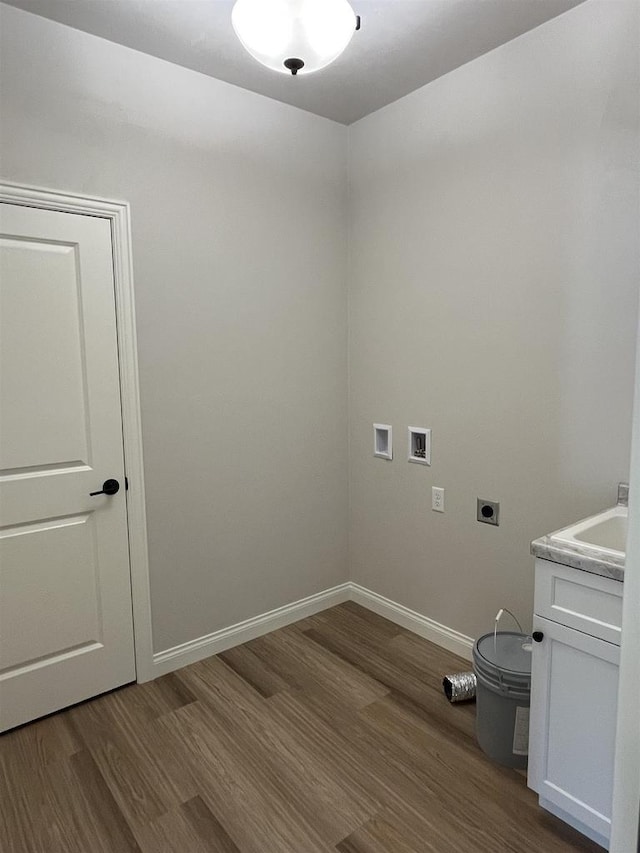 laundry area featuring hookup for an electric dryer, cabinet space, washer hookup, and dark wood-type flooring