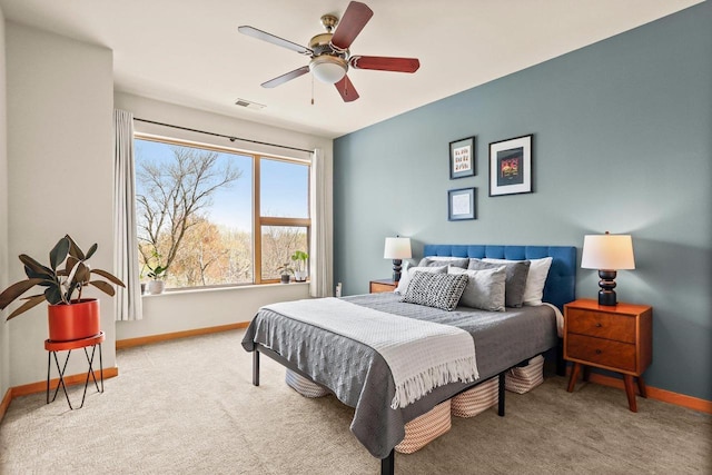 bedroom featuring baseboards, a ceiling fan, carpet flooring, and visible vents