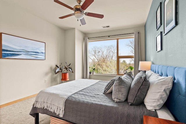 bedroom featuring ceiling fan, carpet flooring, and visible vents