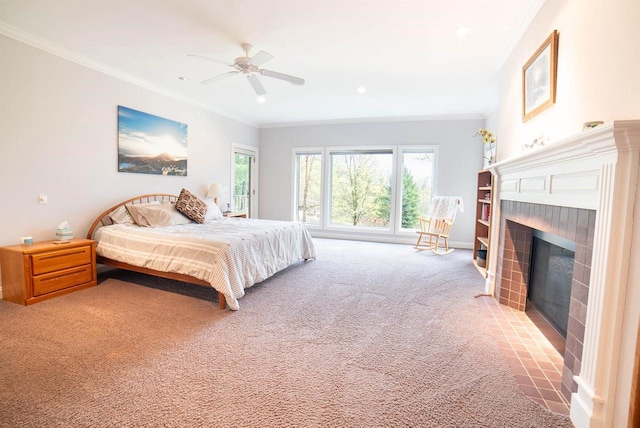 carpeted bedroom featuring a tile fireplace, a ceiling fan, baseboards, ornamental molding, and recessed lighting
