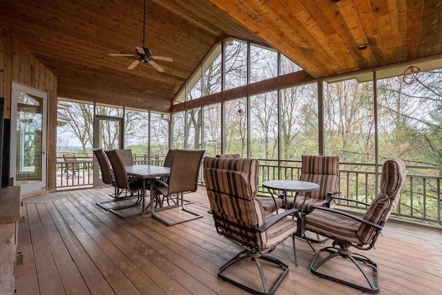 sunroom with ceiling fan, wooden ceiling, outdoor dining space, and high vaulted ceiling