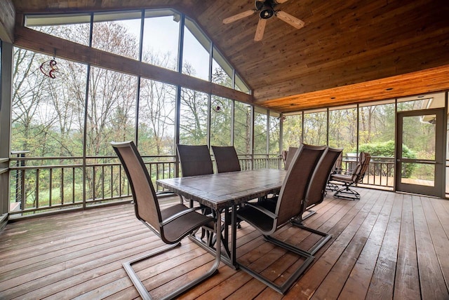 sunroom featuring outdoor dining area and ceiling fan