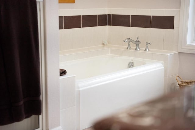 full bath with a garden tub