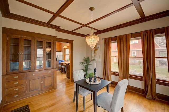 1324 Washington Ave, Oshkosh, WI 54901 - dining space with an inviting chandelier, baseboards, light wood-type flooring, ornamental molding, and coffered ceiling