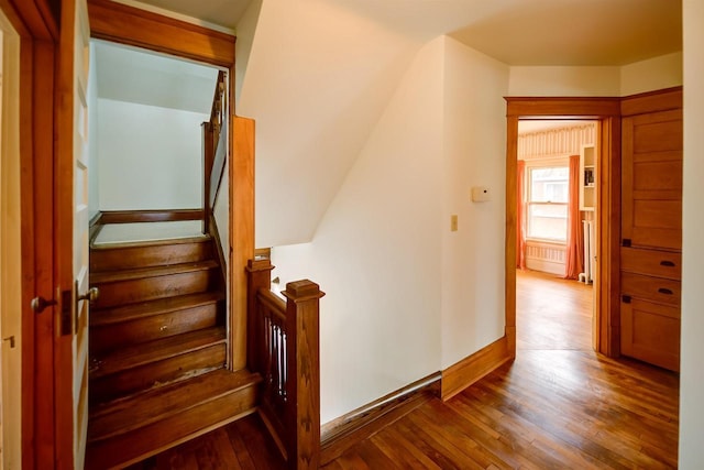 1324 Washington Ave, Oshkosh, WI 54901 - stairway featuring wood-type flooring and baseboards