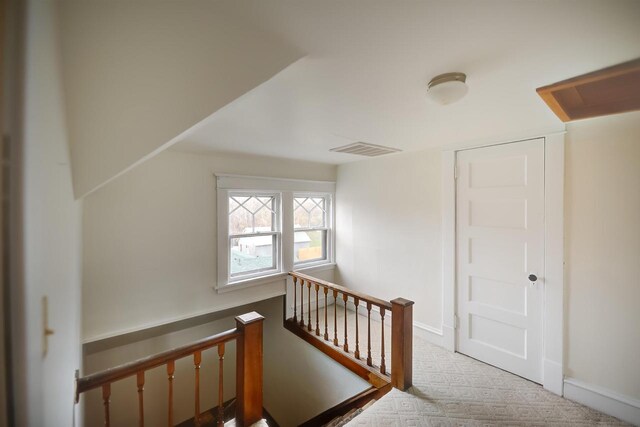 1324 Washington Ave, Oshkosh, WI 54901 - additional living space with carpet floors, baseboards, and visible vents