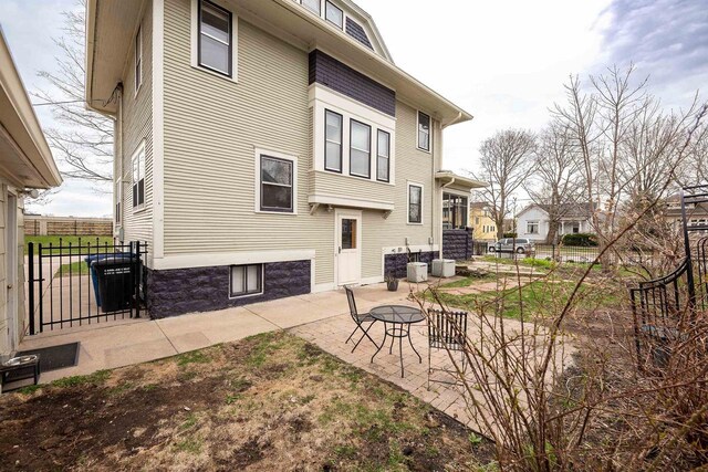 1324 Washington Ave, Oshkosh, WI 54901 - rear view of property with a patio and fence