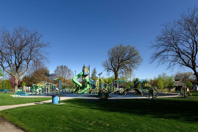 1324 Washington Ave, Oshkosh, WI 54901 - view of home's community featuring a lawn and playground community