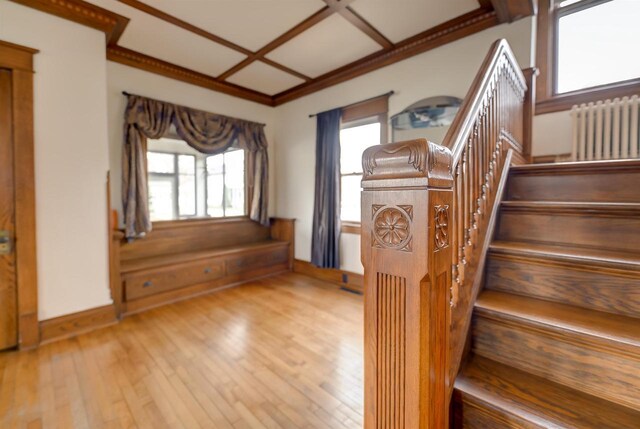 1324 Washington Ave, Oshkosh, WI 54901 - stairs featuring crown molding, radiator, baseboards, and wood-type flooring