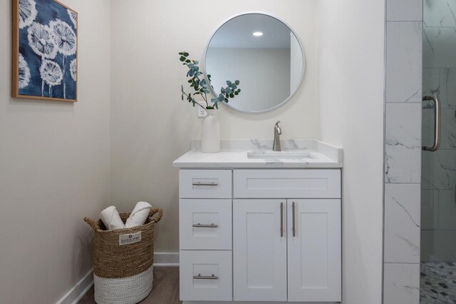 3326 6 Mile Rd, Racine, WI 53402 - bathroom featuring vanity, a stall shower, and baseboards