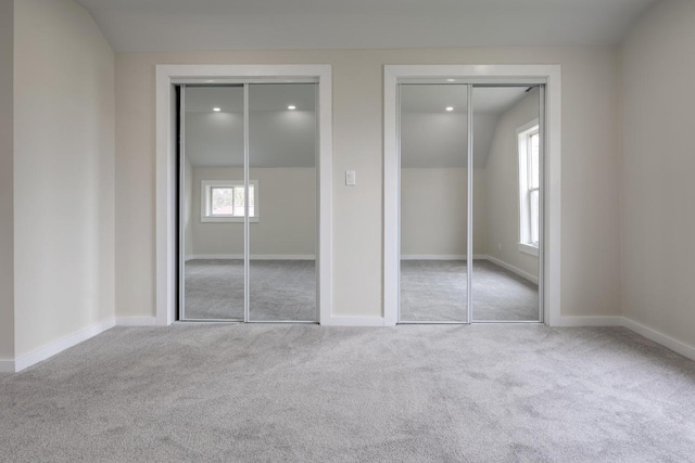 3326 6 Mile Rd, Racine, WI 53402 - unfurnished bedroom with recessed lighting, two closets, carpet floors, and baseboards