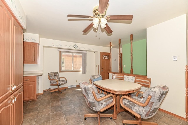 dining room featuring visible vents, ceiling fan, and baseboards