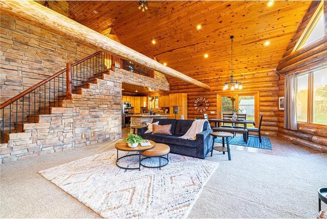 2374 320th St, Clear Lake, WI 54005 - carpeted living area featuring wood ceiling, log walls, plenty of natural light, and a high ceiling