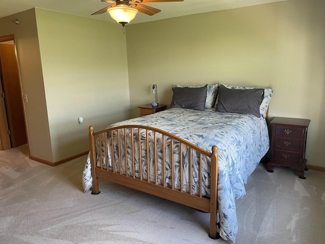 bedroom with baseboards, a ceiling fan, and carpet floors
