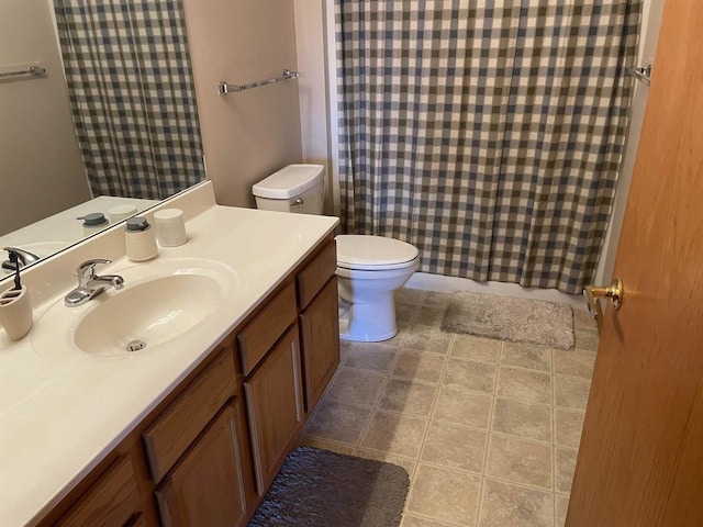 bathroom with vanity, toilet, and a shower with shower curtain