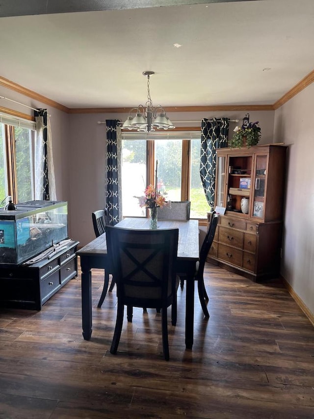 4327 29th St, Kenosha, WI 53144 - dining space featuring a chandelier, crown molding, dark wood finished floors, and baseboards