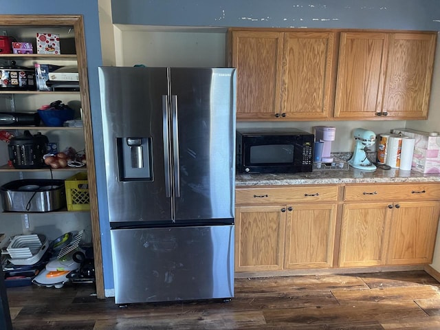 4327 29th St, Kenosha, WI 53144 - kitchen featuring stainless steel fridge with ice dispenser, black microwave, dark wood-type flooring, and light stone counters