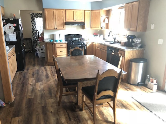 4327 29th St, Kenosha, WI 53144 - kitchen featuring black gas stove, under cabinet range hood, a sink, and dark wood-style flooring