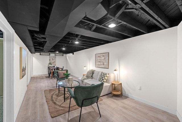 interior space with baseboards and wood finished floors