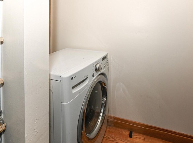 4308 W Dr, Delavan, WI 53115 - washroom featuring wood finished floors, laundry area, and baseboards