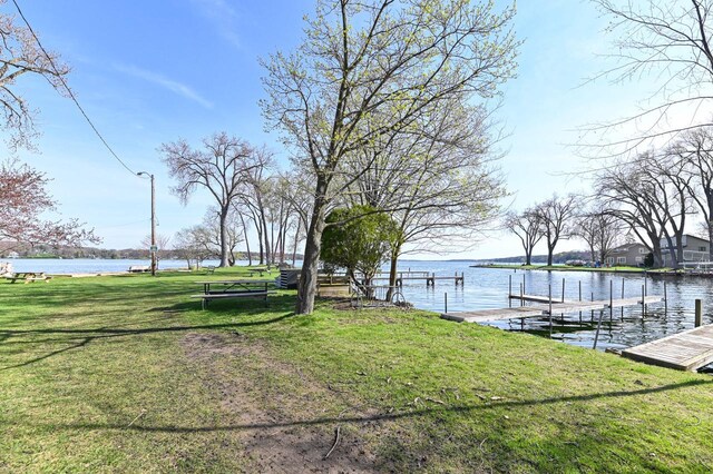 4308 W Dr, Delavan, WI 53115 - view of yard with a water view and a boat dock