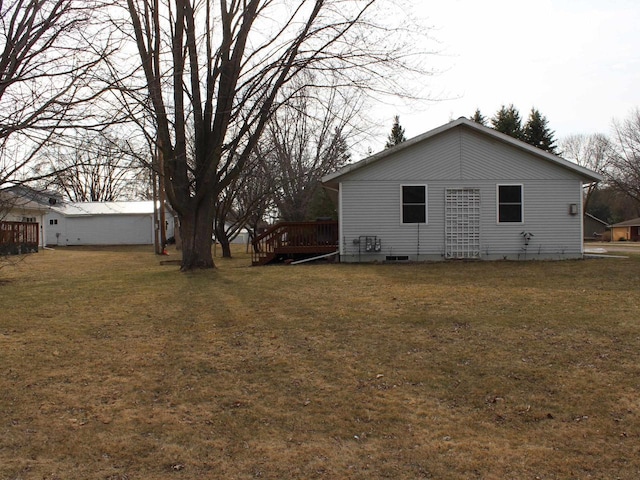 exterior space featuring a deck and a yard