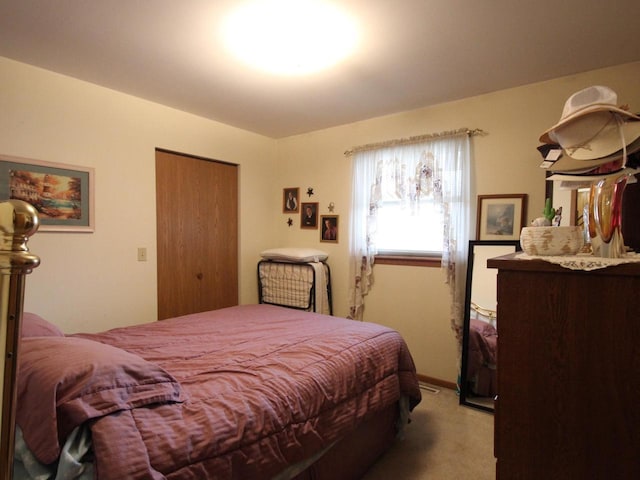 carpeted bedroom with a closet