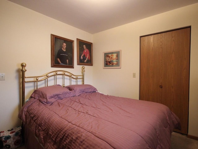bedroom with a closet and carpet floors