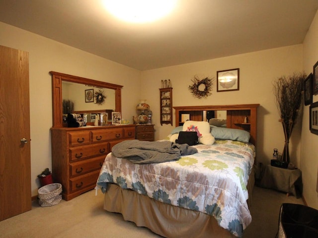 bedroom featuring light colored carpet