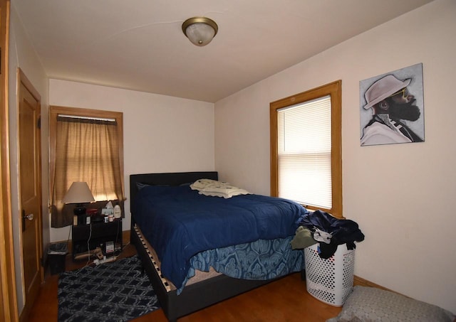 bedroom with wood finished floors
