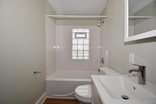 full bathroom featuring shower / bathtub combination, toilet, a sink, and wood finished floors