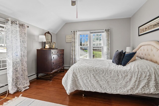 515 Maple Hill Ter, Twin Lakes, WI 53181 - bedroom with lofted ceiling, wood finished floors, and a baseboard radiator