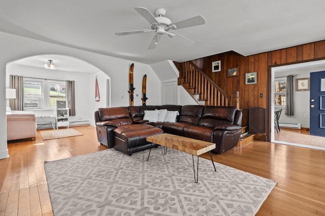 515 Maple Hill Ter, Twin Lakes, WI 53181 - living area featuring hardwood / wood-style flooring, stairway, ceiling fan, arched walkways, and wooden walls