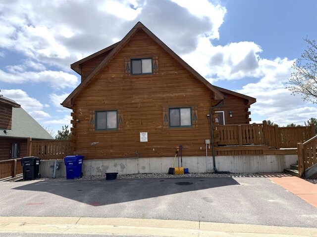 475 Overlook Ct, Warrens, WI 54666 - view of property exterior featuring a wooden deck and log exterior