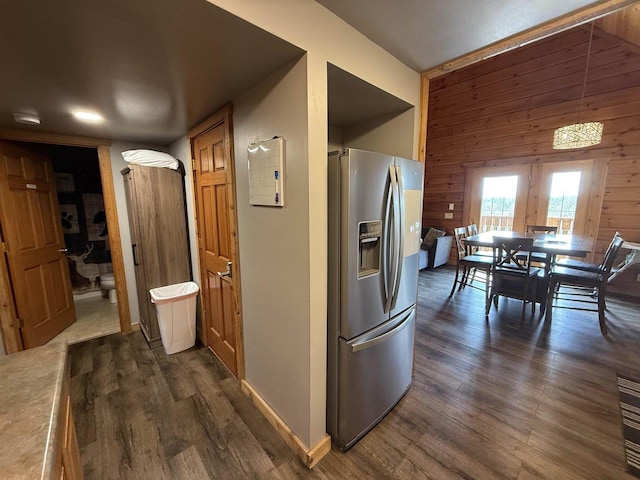 475 Overlook Ct, Warrens, WI 54666 - kitchen with dark wood-style floors, stainless steel refrigerator with ice dispenser, and wooden walls