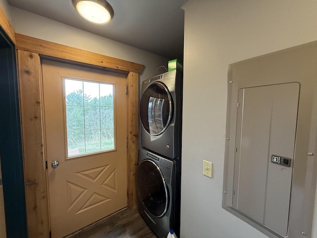475 Overlook Ct, Warrens, WI 54666 - clothes washing area with electric panel, stacked washer / dryer, dark wood-style flooring, and laundry area
