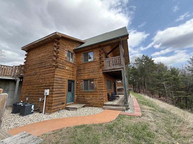 475 Overlook Ct, Warrens, WI 54666 - rear view of property with central AC, a wooden deck, a balcony, and log siding